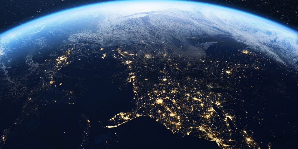 A globe wrapped in orbiting data paths